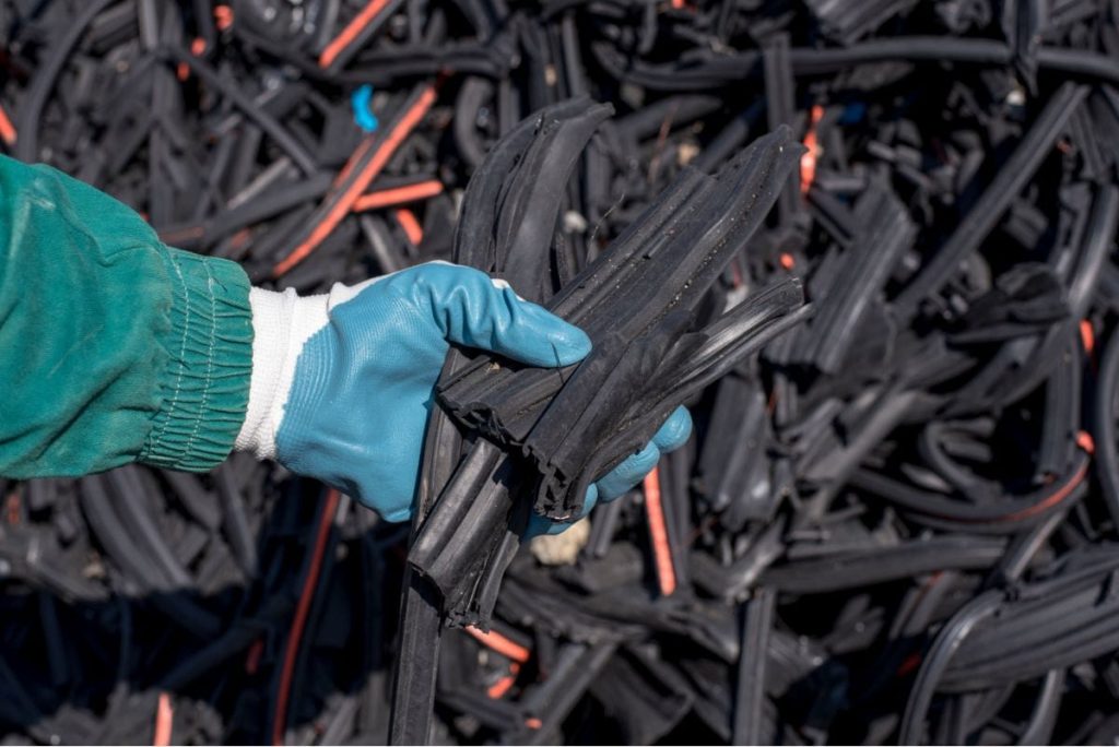 person holding strips of rubber